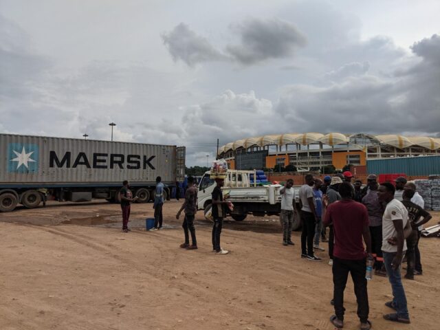 Loading roof sheets and steel by Hero Stadium in Lusaka